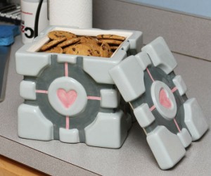 Do you love portal? And do you also love cookies? Then why not treat yourself to both with the Portal Companion Cube cookie jar.