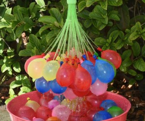 A hose attachment that fills up 148 water balloons in under a minute… Where was this when I was a kid?!