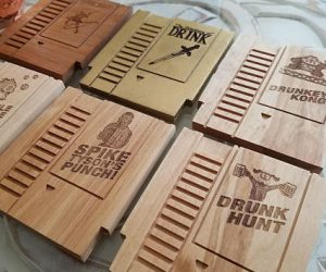 Wooden Gaming Coasters – These Solid Wood Coasters are made from a random mixture of Cherry, Alder, Pecan, Walnut, Maple, Cedar, and Beech wood. Graphics are laser engraved onto the