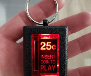 Insert Coin To Play Arcade Keychain – This Insert Coin Key Chain is made from heavy-duty diecast metal accurately recreating the original arcade machine coin doors found on many of your