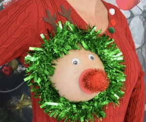 Everybody will be staring when you walk into your next Christmas party wearing this Ugly Christmas sweater. This sweater uses your actual exposed breast to create a hilarious new look.